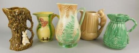 A collection of Sylvac and other Art Deco style jugs