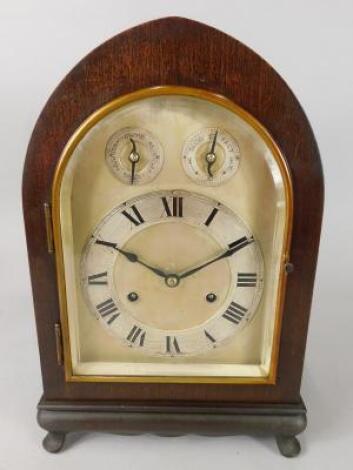 An early 20thC mahogany lancet shaped mantel clock