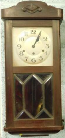 A 1920's mahogany wall clock