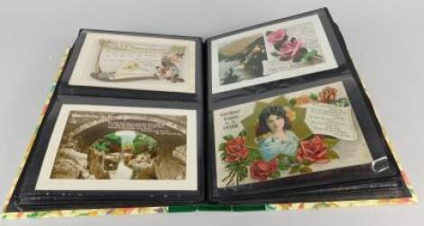 An album containing a number of early 20thC greetings cards