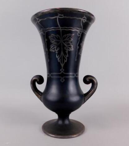 A black Art Glass two handled vase