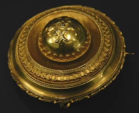 A bloomed gold Victorian memorial brooch