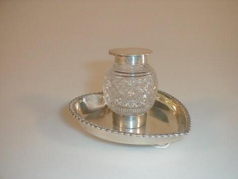 An Edwardian silver ink stand with cut crystal silver top ink well