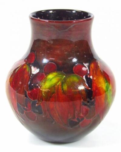 An early 20thC Moorcroft flambe Leaf and Berry pattern vase