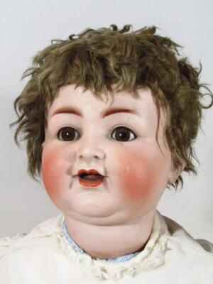 A very early 20thC Simon & Halbig bisque headed talking doll - 2