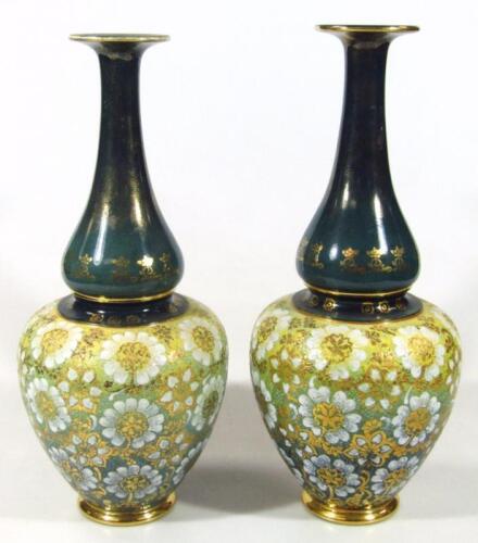 A pair of early 20thC Doulton Slater's Patent Art Nouveau vases