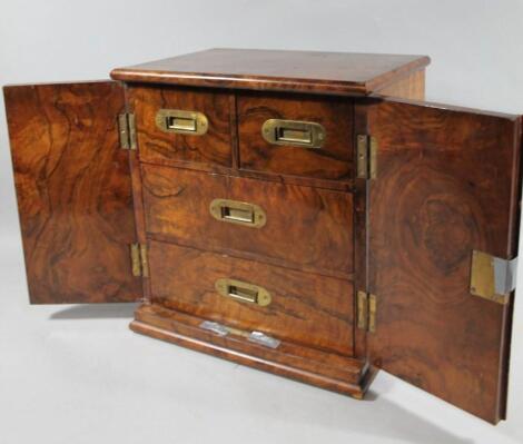 An Edwardian walnut travelling tabletop cabinet