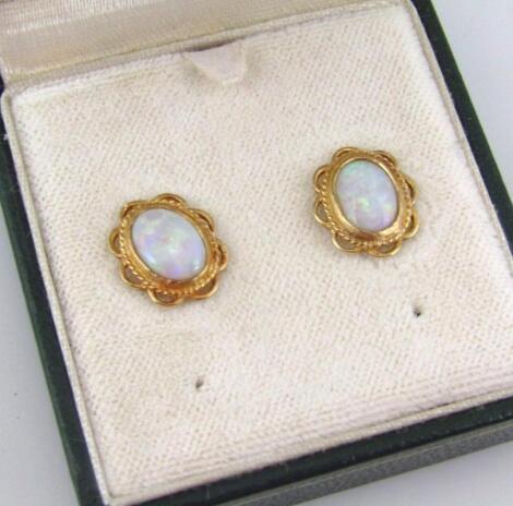 A pair of 9ct gold opal cluster earring