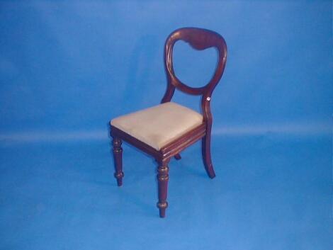 A set of four Victorian mahogany balloon back dining chairs with drop-in seats