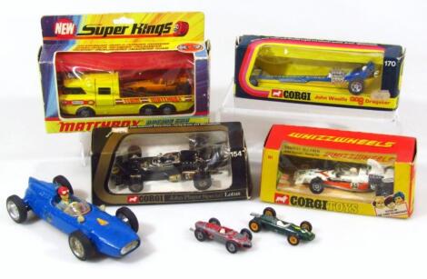 Various unboxed and boxed die-cast racing cars