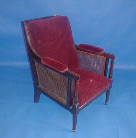 A Regency mahogany library chair with reeded and bergere framing