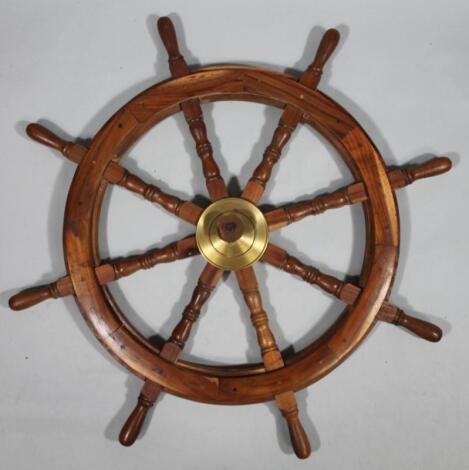 A modern stained wooden ship's wheel