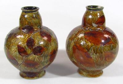 A matched pair of early 20thC Doulton stoneware vases