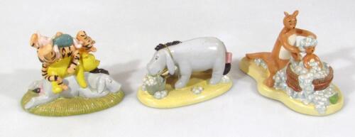 A Royal Doulton Winnie The Pooh Bath Time Collection figures