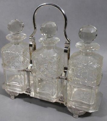 A 20thC silver plated three bottle decanter set - 3