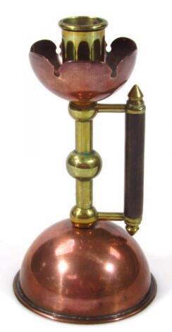 A later 19thC copper and brass Arts and Crafts candlestick