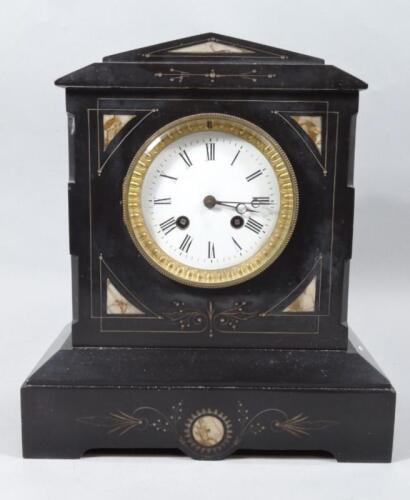 A late Victorian black slate mantel clock