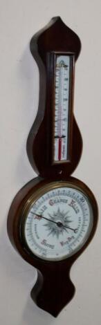 An early 20thC mahogany cased onion topped banjo barometer and thermometer