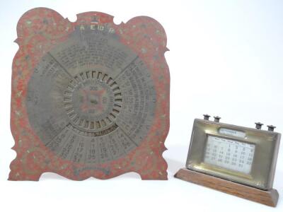 A mid 20thC oak cased desk calendar