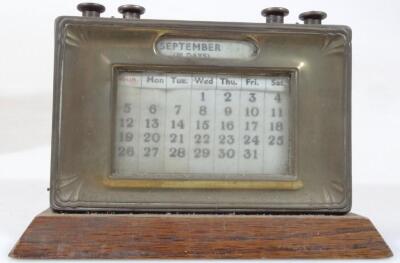 A mid 20thC oak cased desk calendar - 3