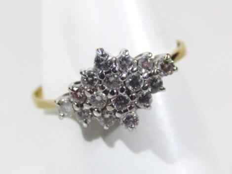 A ladies 18ct gold lozenge shaped diamond cluster ring