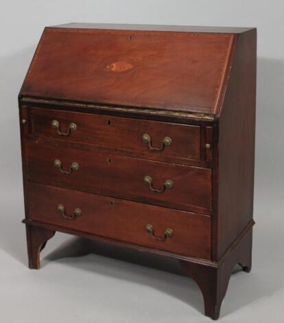 An Edwardian mahogany and boxwood strung Sheraton revival bureau