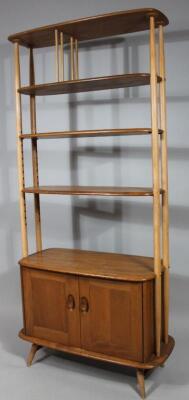 An Ercol light wood shelf unit