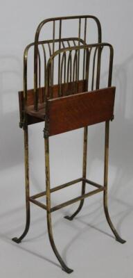 A 20thC oak and brass freestanding newspaper rack