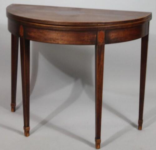 A 19thC Sheraton revival fold over tea table