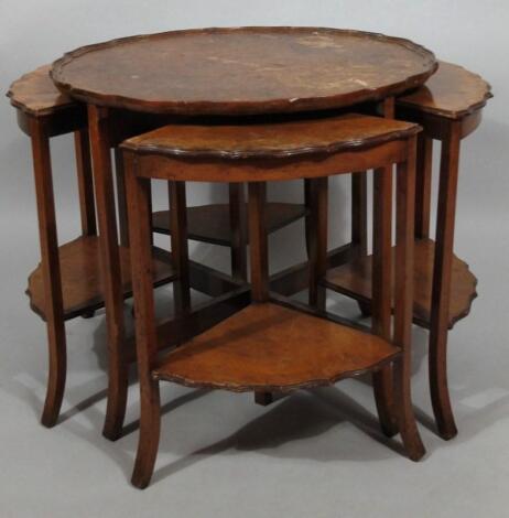 A 1930's walnut veneered occasional table set