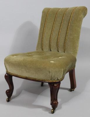 A late Victorian walnut framed nursing chair