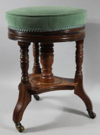 An Edwardian Aesthetic style circular adjustable piano stool