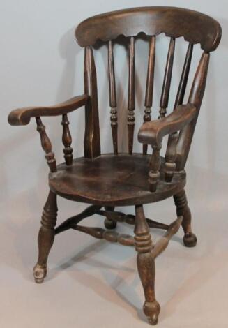 A late 19thC ash and elm Windsor type chair. with comb top