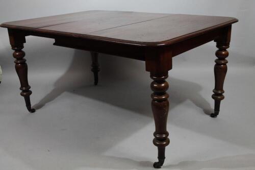 A Victorian mahogany extending dining table