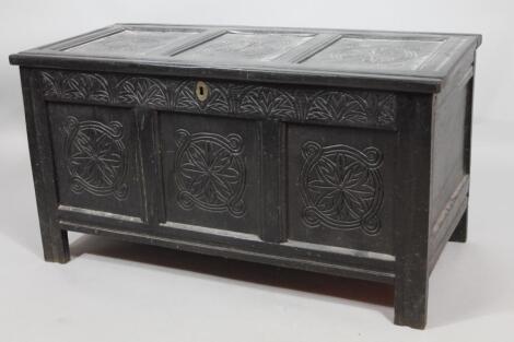 A principally 18thC ebonised oak three panelled coffer