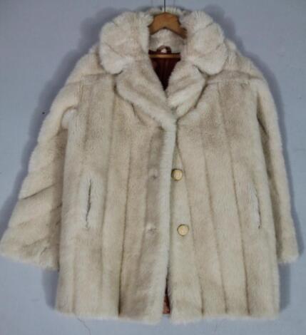 A ladies quarter length fur coat