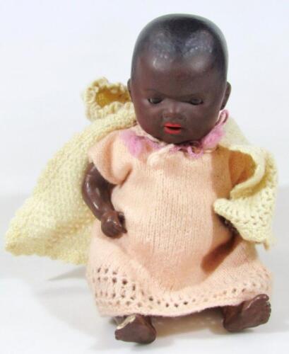 An early 20thC Armand Marseille bisque headed black baby doll