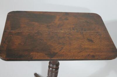 An early 19thC oak snap top table - 2