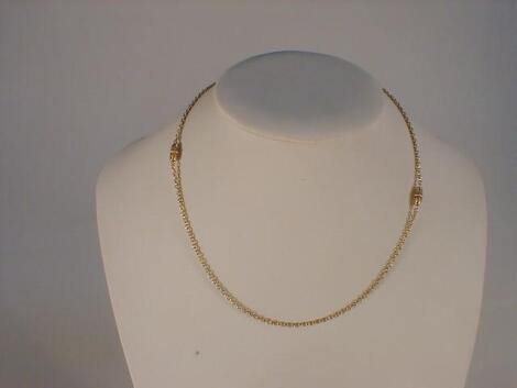 A fancy link neck chain stamped 15ct