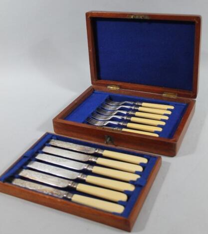 A mahogany cased set of entree knives and forks