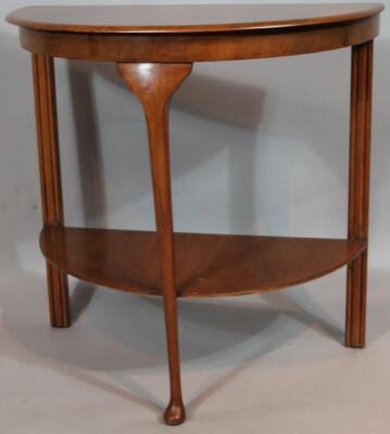 A mid 20thC walnut finish D-end hall table