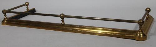 A 20thC brass D-end fire kerb