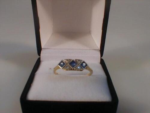 An Art Deco style diamond and sapphire set ring
