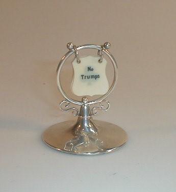 An Edwardian silver bridge counter with circular base (rubbed marks) in