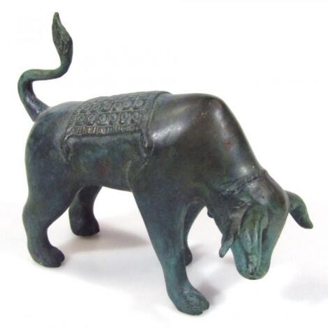 A 20thC bronze style figure of a standing bull