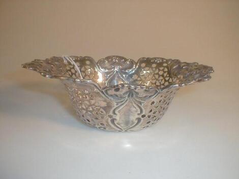 An Edward Vll silver bowl by Walker and Hall of oval form with rococo scrolls