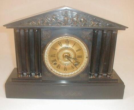 A Victorian black slate mantel clock