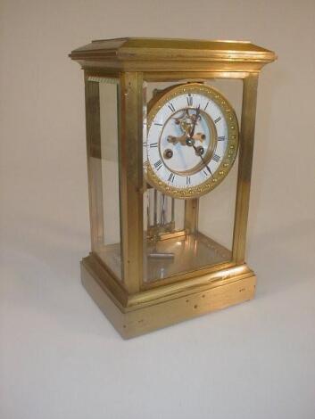 An early 20thC French gilt metal four glass mantel clock with a Brocot