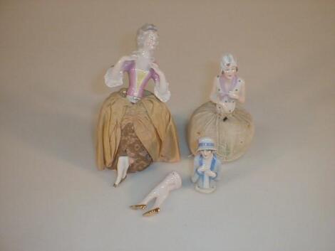 Two German porcelain half doll pin cushions