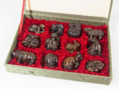 A set of twelve Chinese polished wooden netsuke zodiac figures